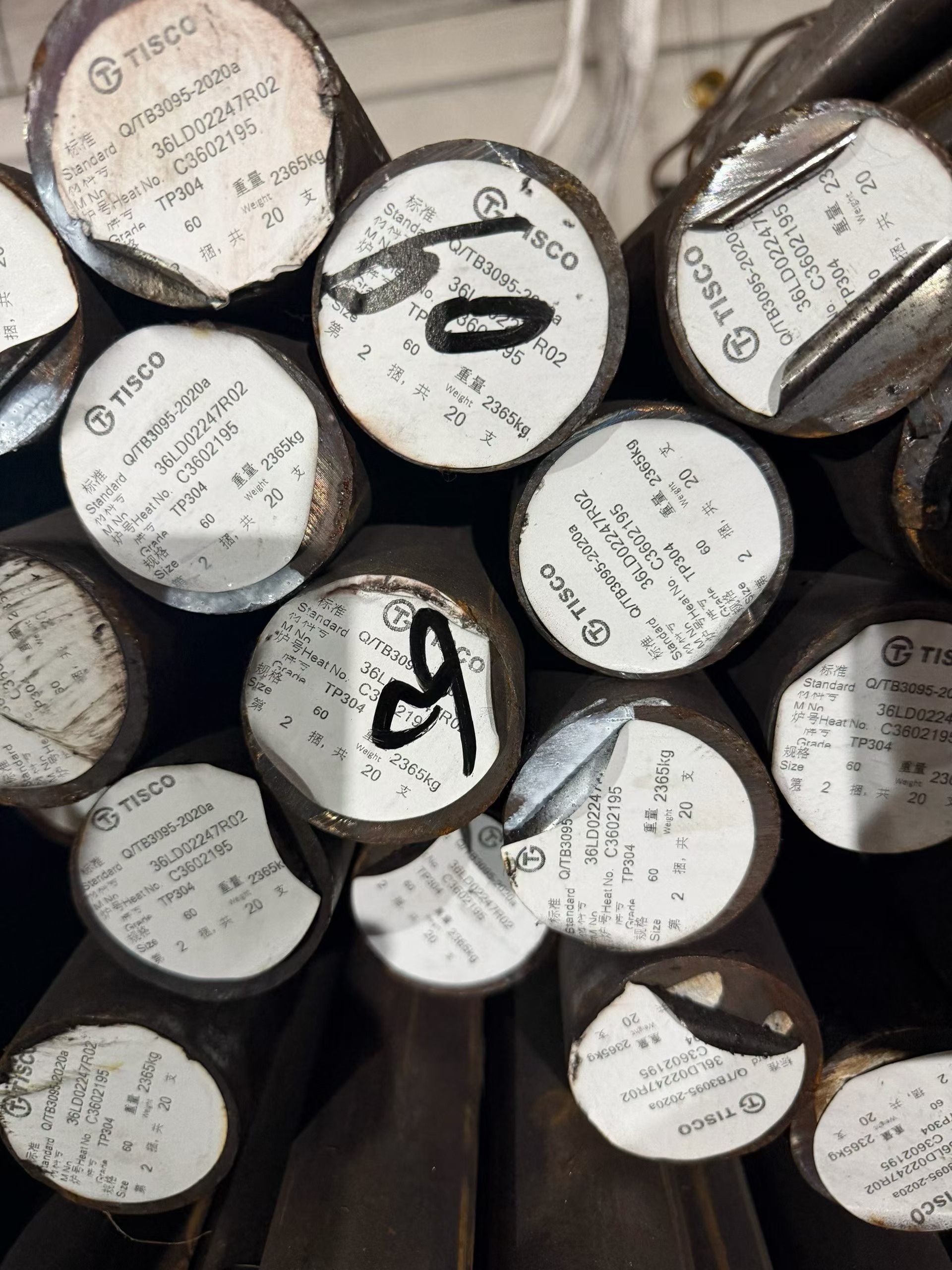 Tisco bundles of stainless steel round bar in a warehouse