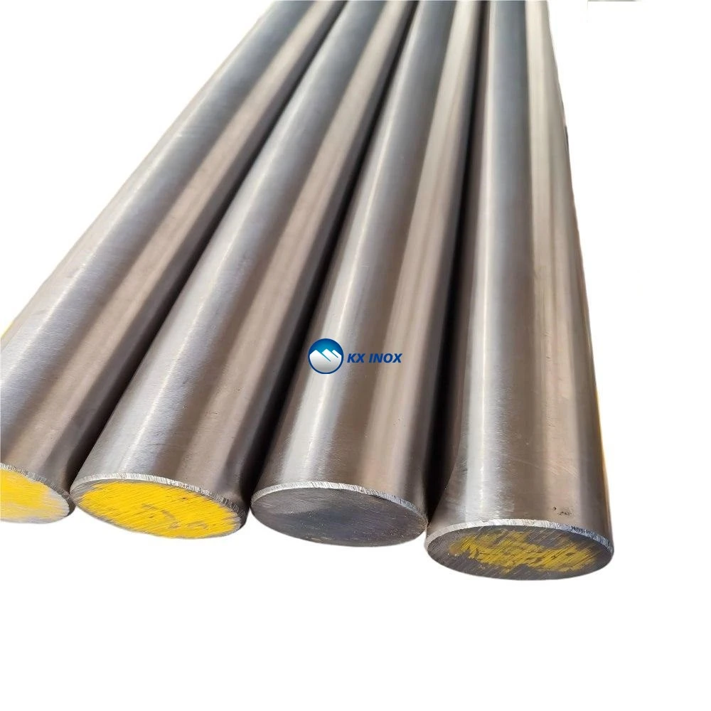 polished stainless steel round bars stacked in a warehouse
