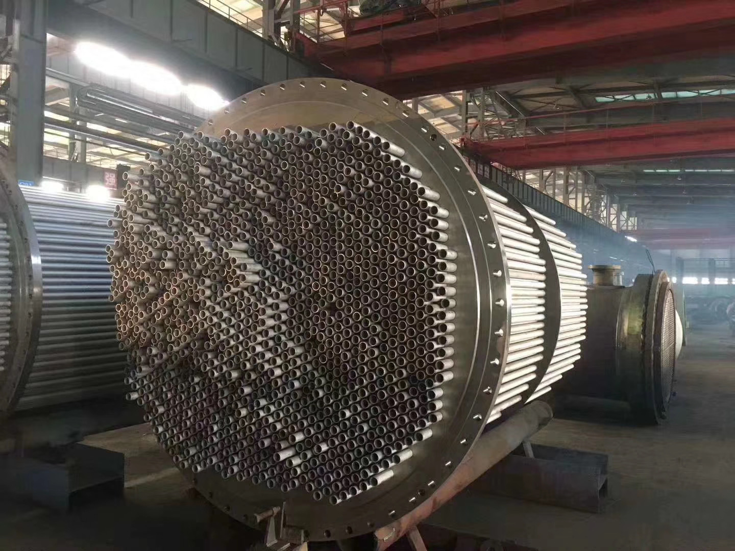 technician inspecting nickel alloy heat exchanger tubes during scheduled maintenance