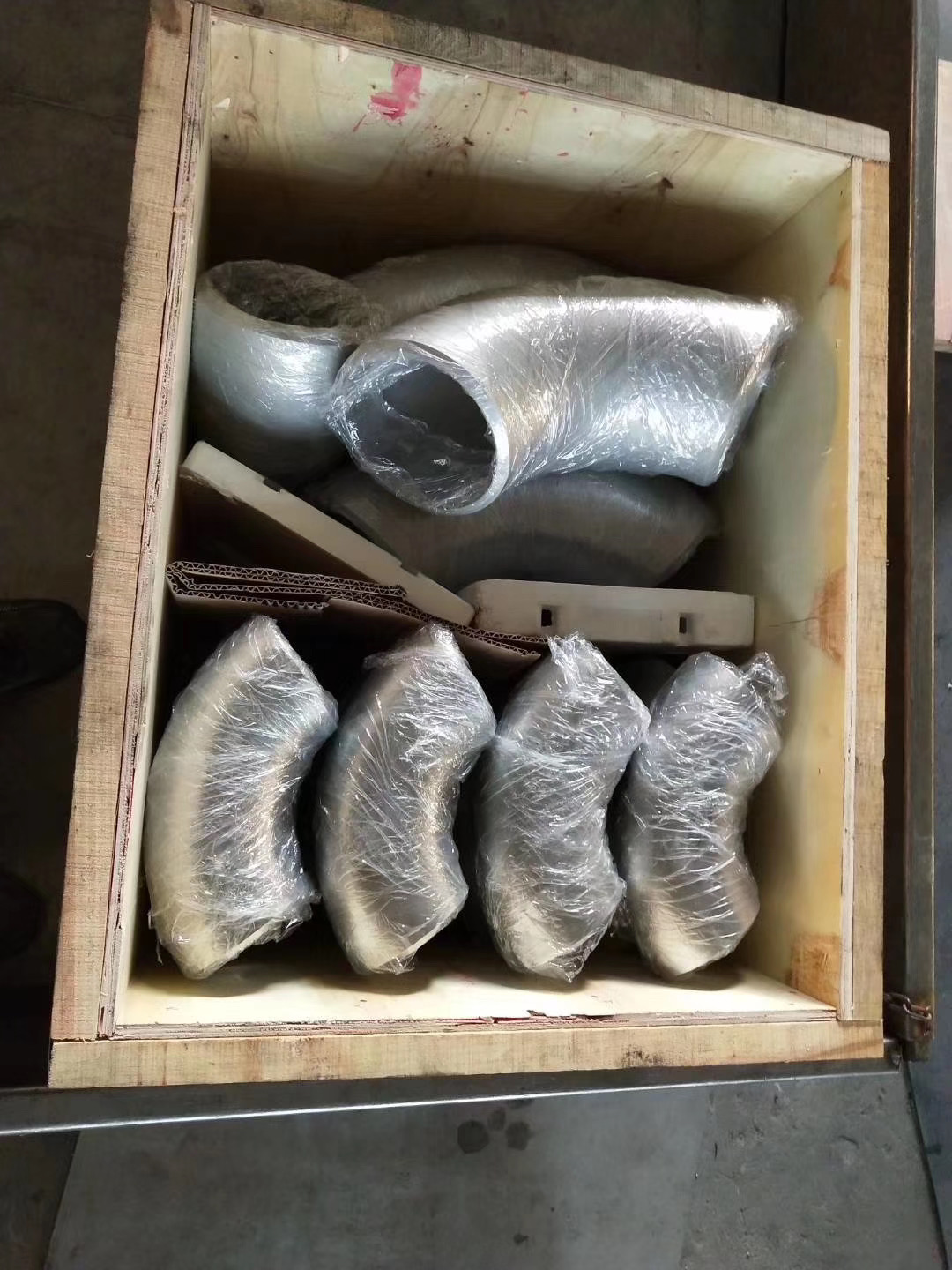Stainless pipe fittings and tubing arranged for industrial gasline work